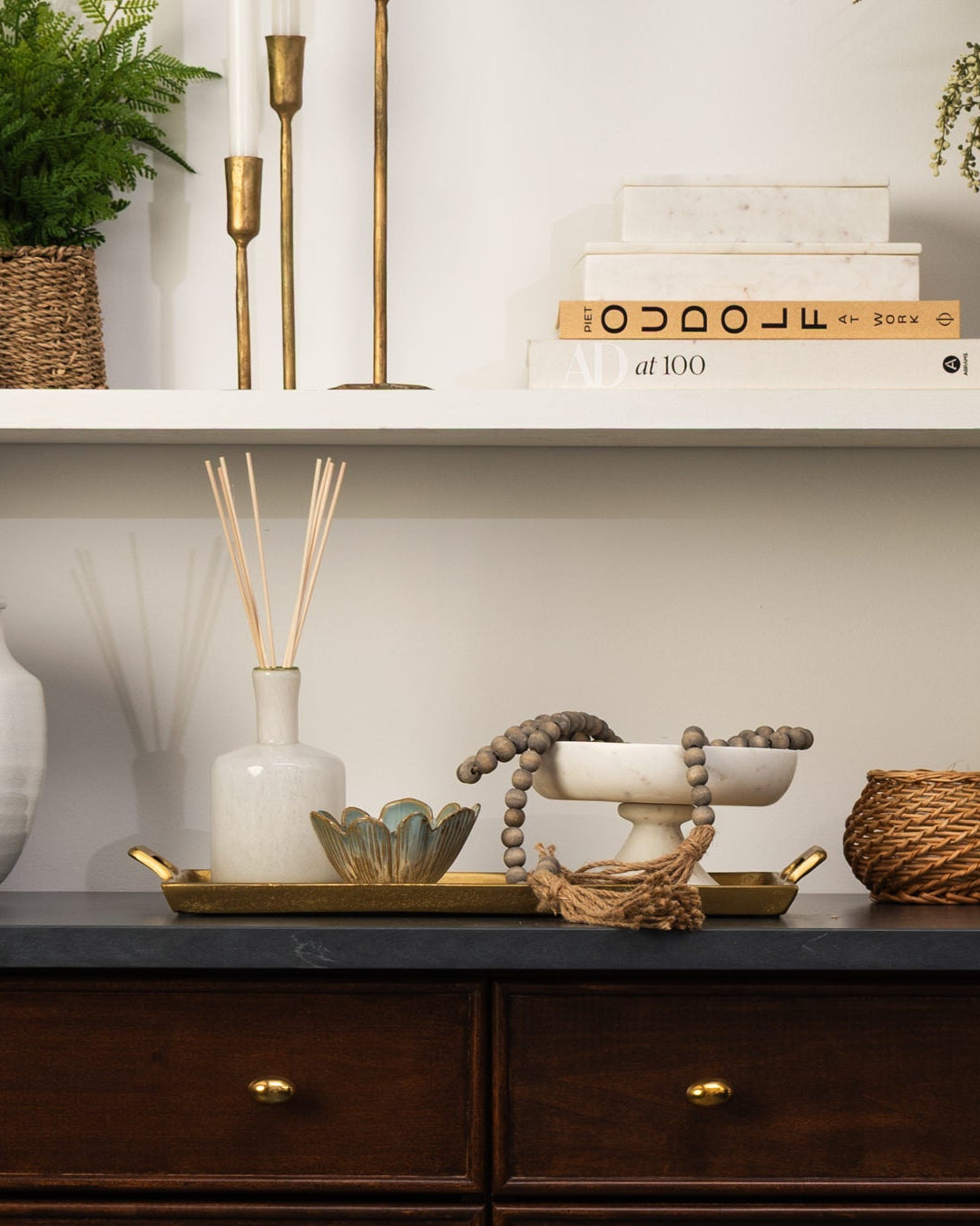 White shelves styled with white and neutral decor at Addison West