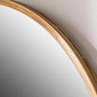 Close up of Herwick Oval Accent Mirror on a white wall at Addison West