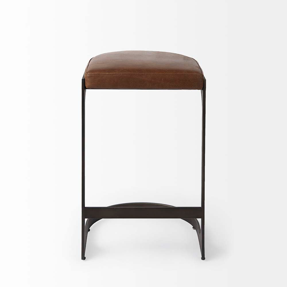 Black bar stool with iron base and U-shaped leather seat on a white background