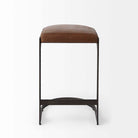 Black bar stool with iron base and U-shaped leather seat on a white background