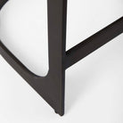 Black bar stool with iron base and U-shaped leather seat on a white background
