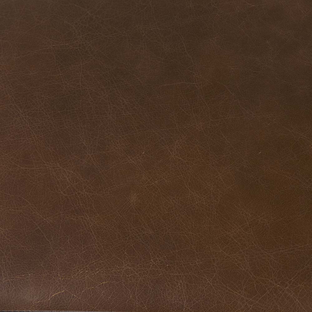 Black bar stool with iron base and U-shaped leather seat on a white background