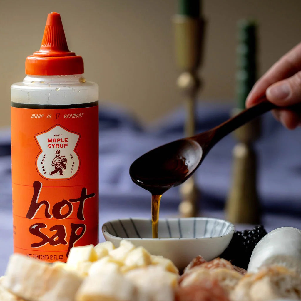 Hot Sap Spicy Maple Syrup with food at Addison West