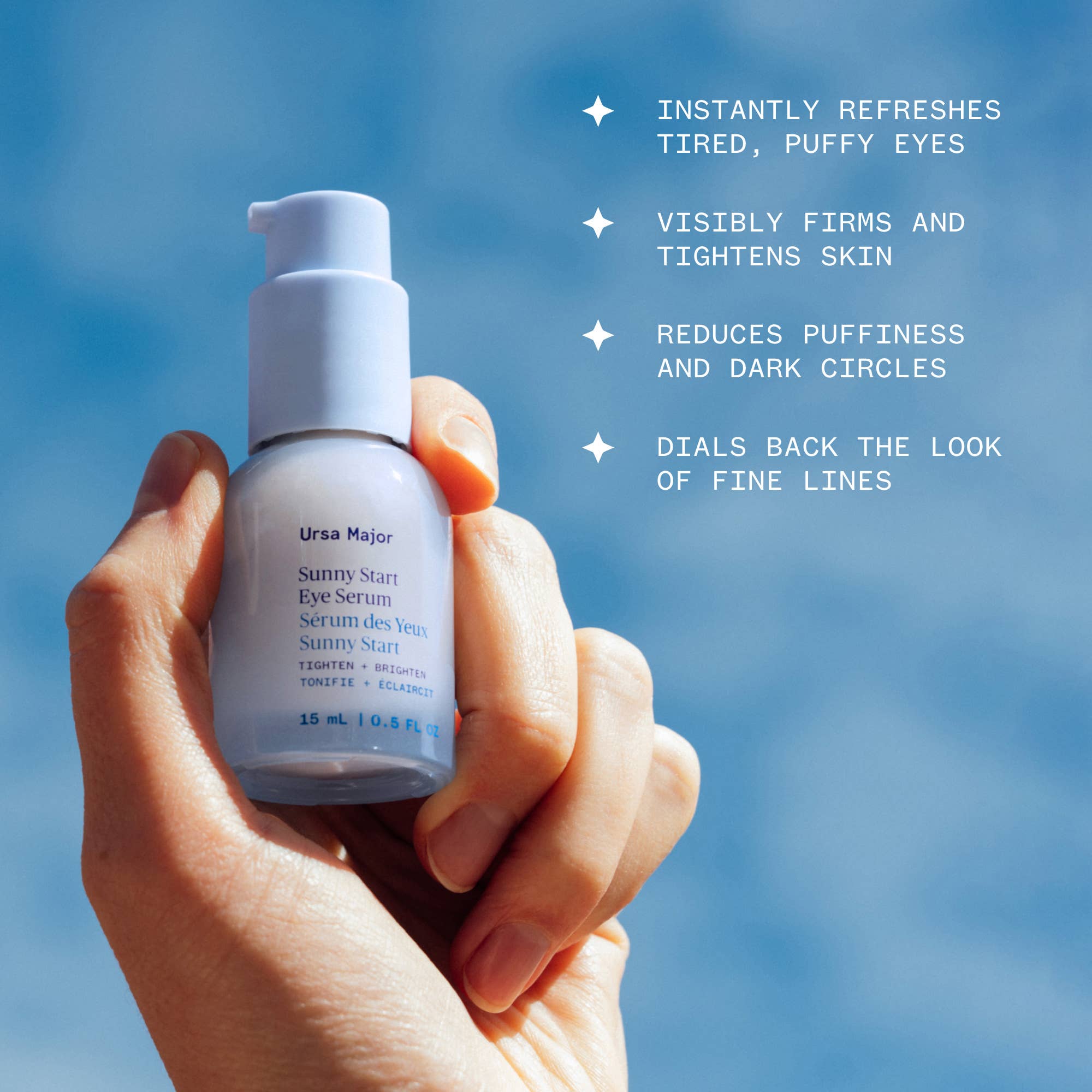 Ursa Major Sunny Start Eye Serum held by a model at Addison West