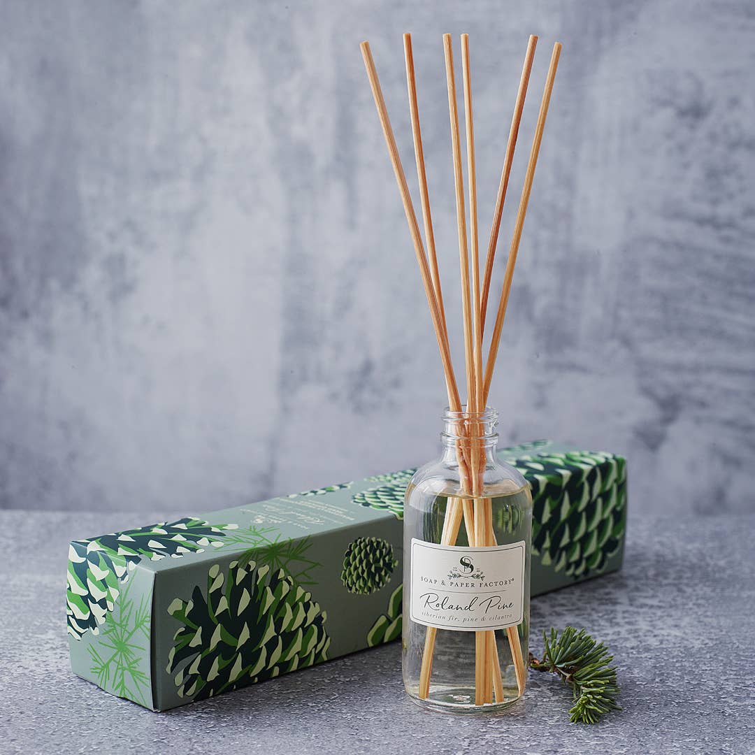 Roland Pine Reed Diffuser on a grey background at Addison West