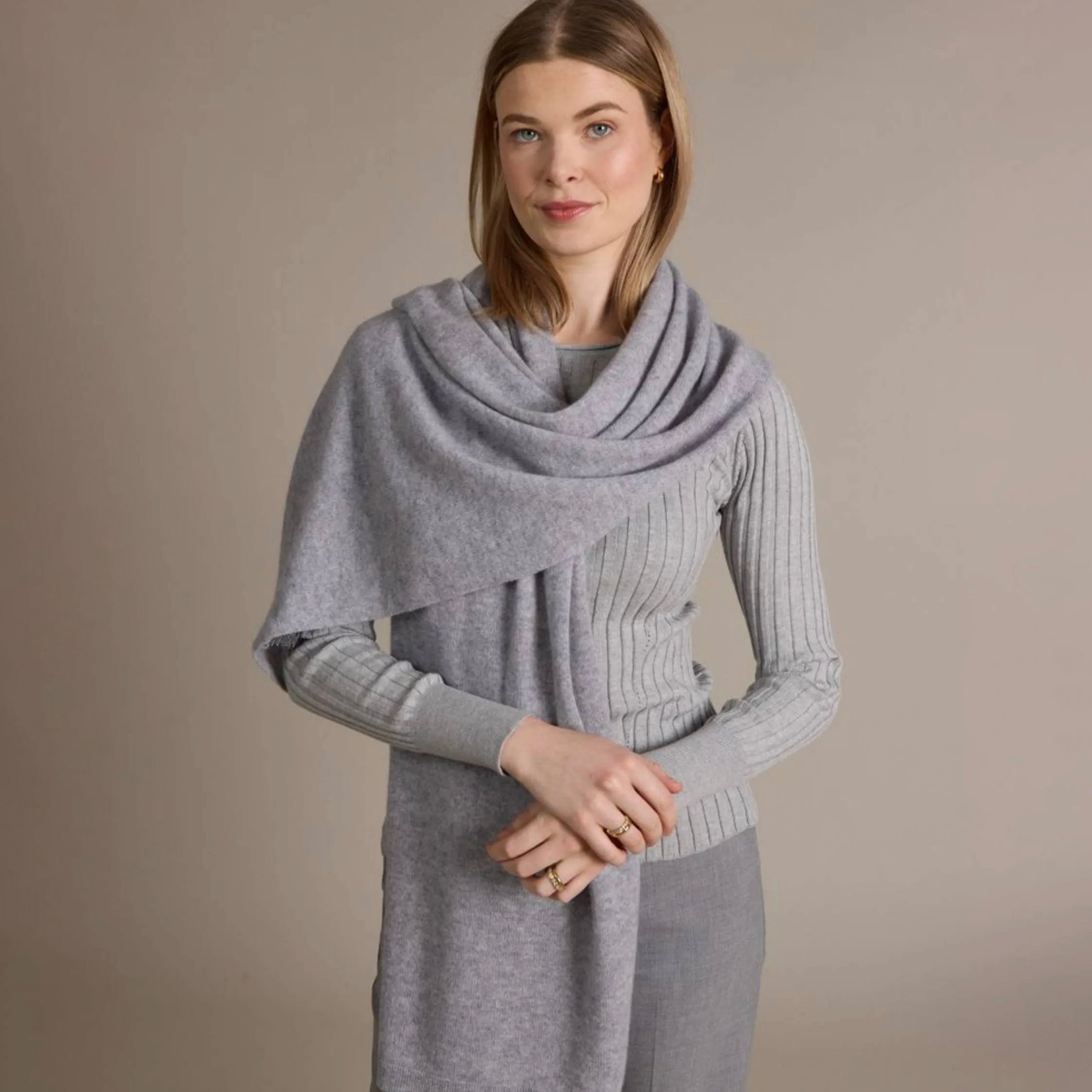 100% Cashmere Mini Luxe Travel Wrap in Harbor on a model at Addison West