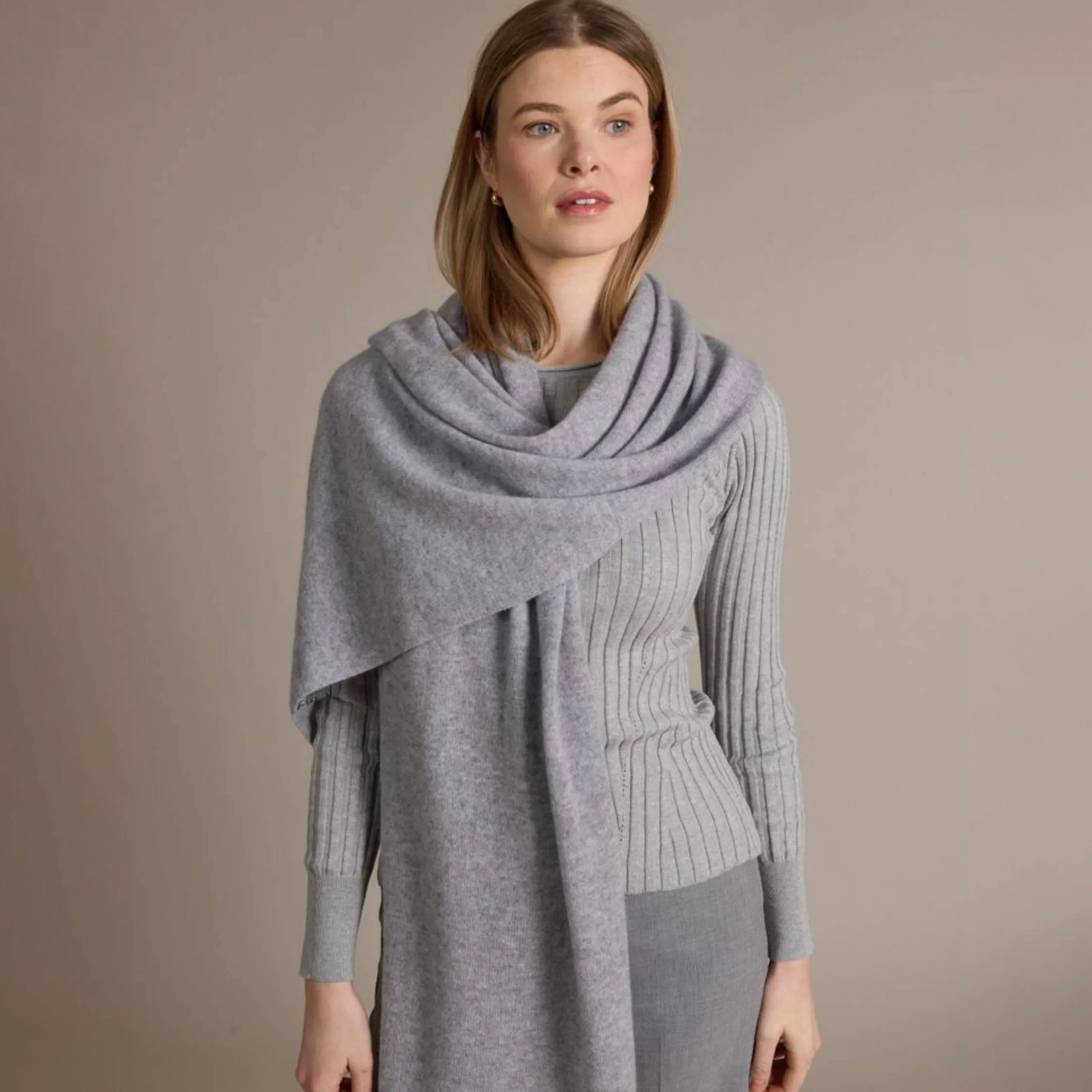 100% Cashmere Mini Luxe Travel Wrap in Harbor on a model at Addison West