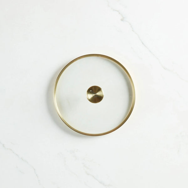 Smithey 12" Glass Lid on a marble surface