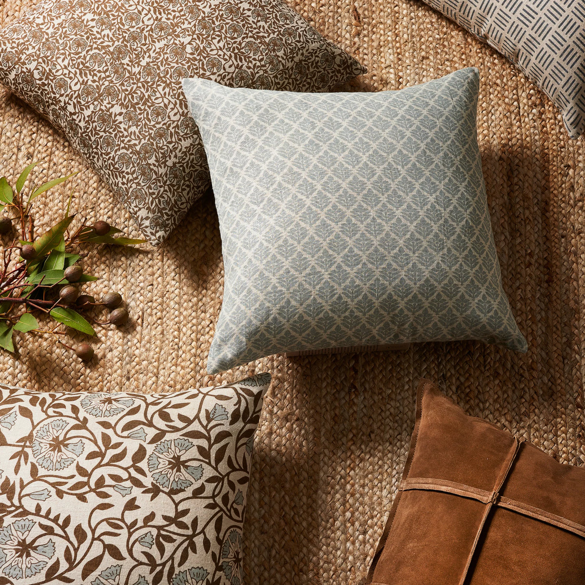 Piper Mist Pillow 22" on a floor at Addison West