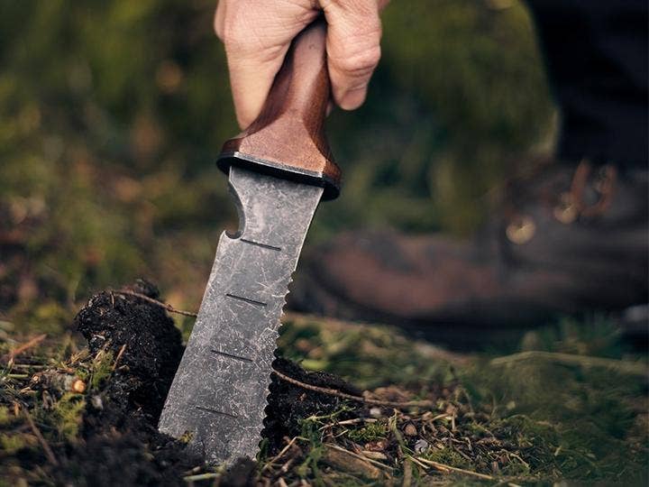 Barebone Hori Hori Ultimate with Sheath held by a person at Addison West