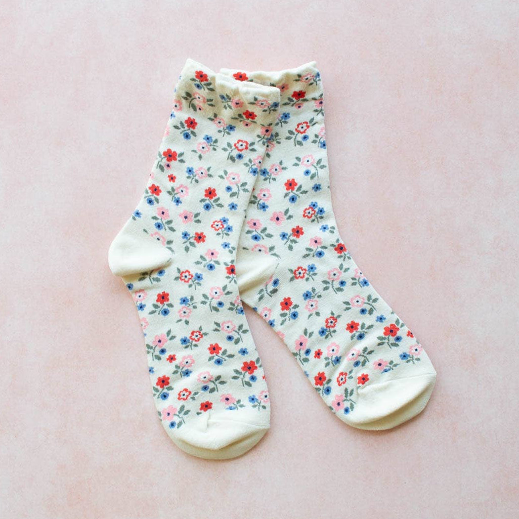 Garden Flower Socks in Ivory on a pink background at Addison West