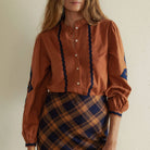 Leonor Blouse in Caramel on a white background at Addison West