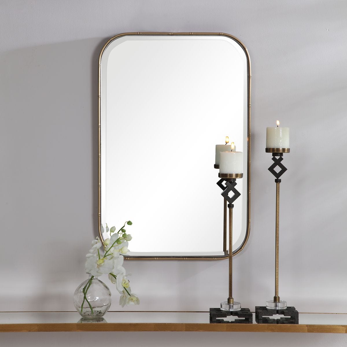 Marwell Vanity Accent Mirror on a white above a table at Addison West