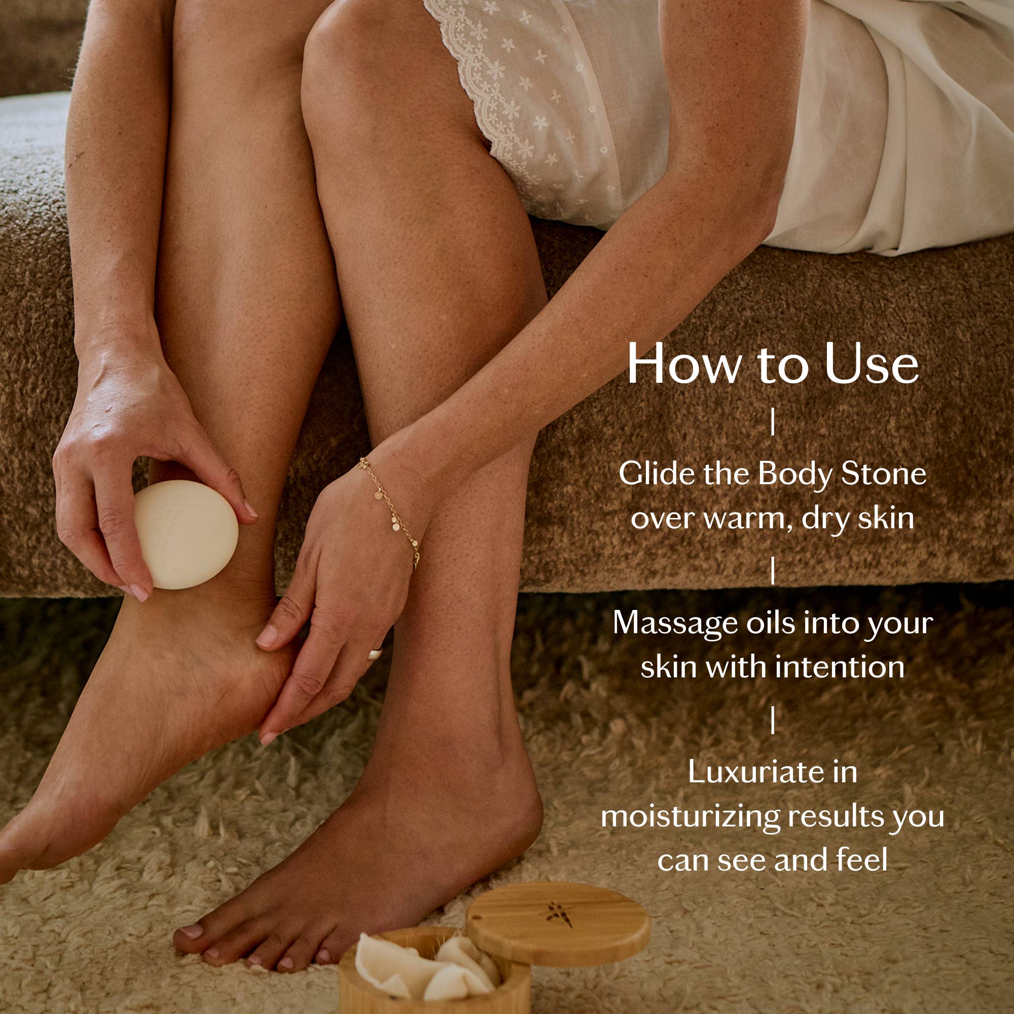 Tonka Bean & Coconut Deep Moisturizing Lotion Bar held by a model at Addison West