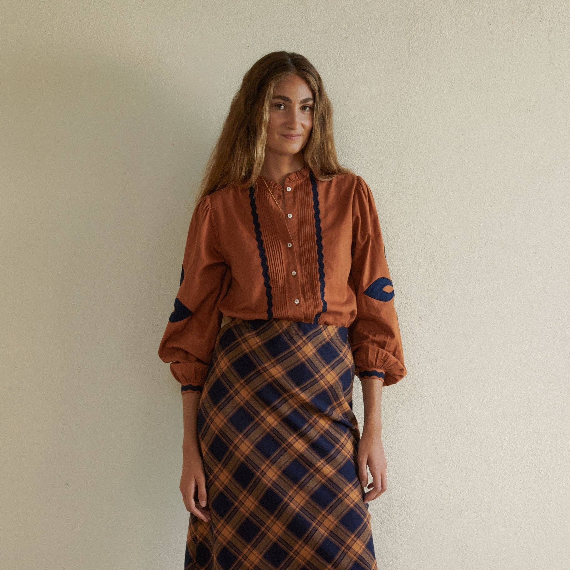 Leonor Blouse in Caramel on a white background at Addison West