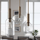 Bronson Glass Pendant, Wide, round and tall in Brass on a white background at Addison West