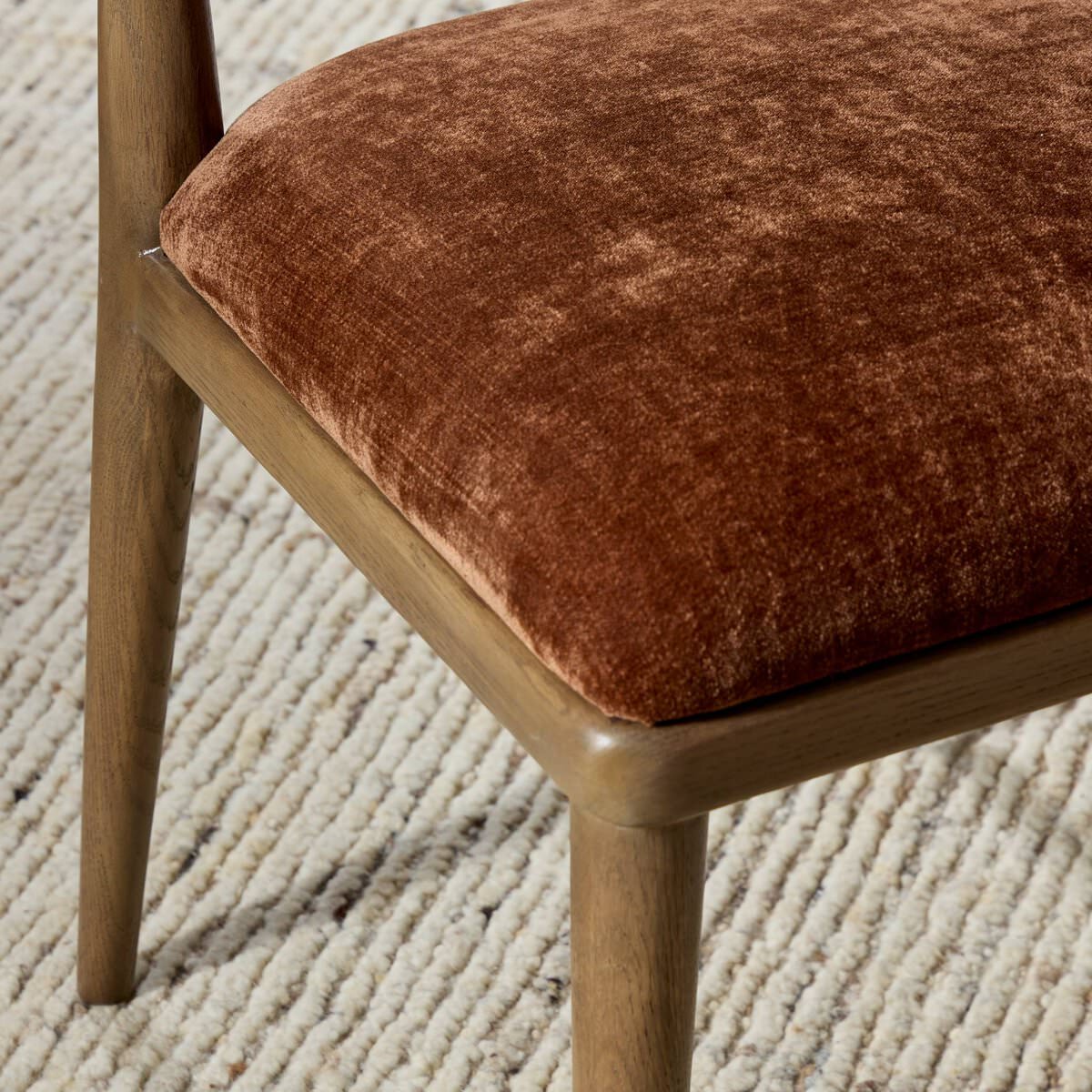 Close up of Four Hands Marley Dining Chair in Altair Sienna in a dining room at Addison West