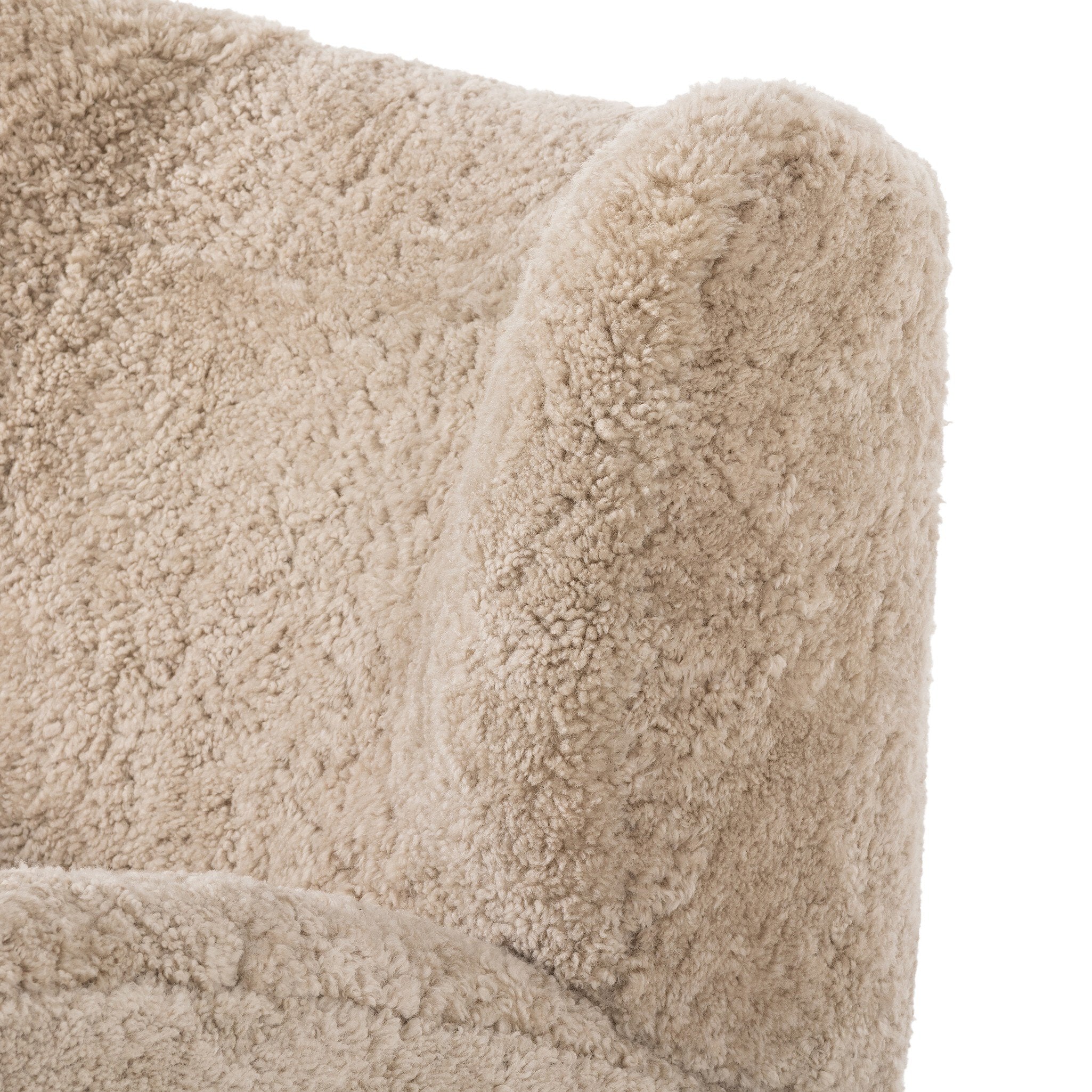 Four Hands Amelie Swivel Recliner in Beige Shearling on a white background at Addison West
