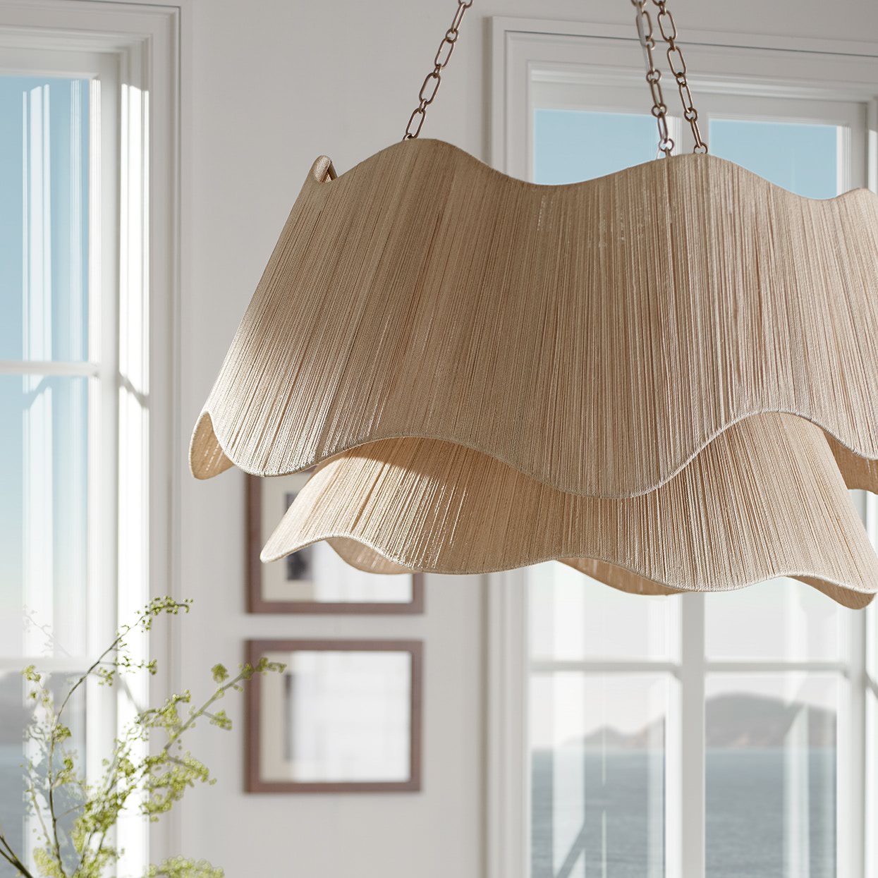 Palecek Seville Tiered Chandelier in a living room at Addison West