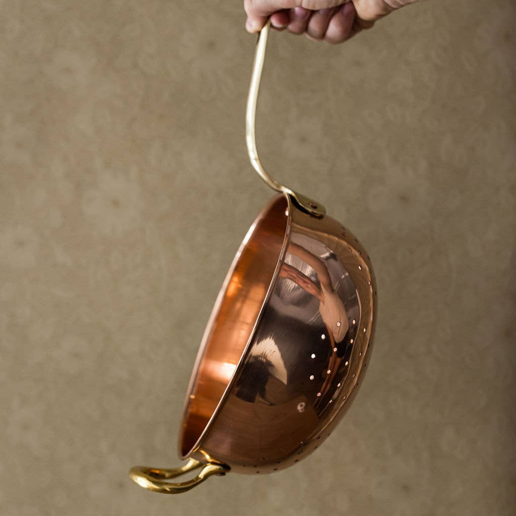 Galley and Fenn Copper Colander on a beige background at Addison West