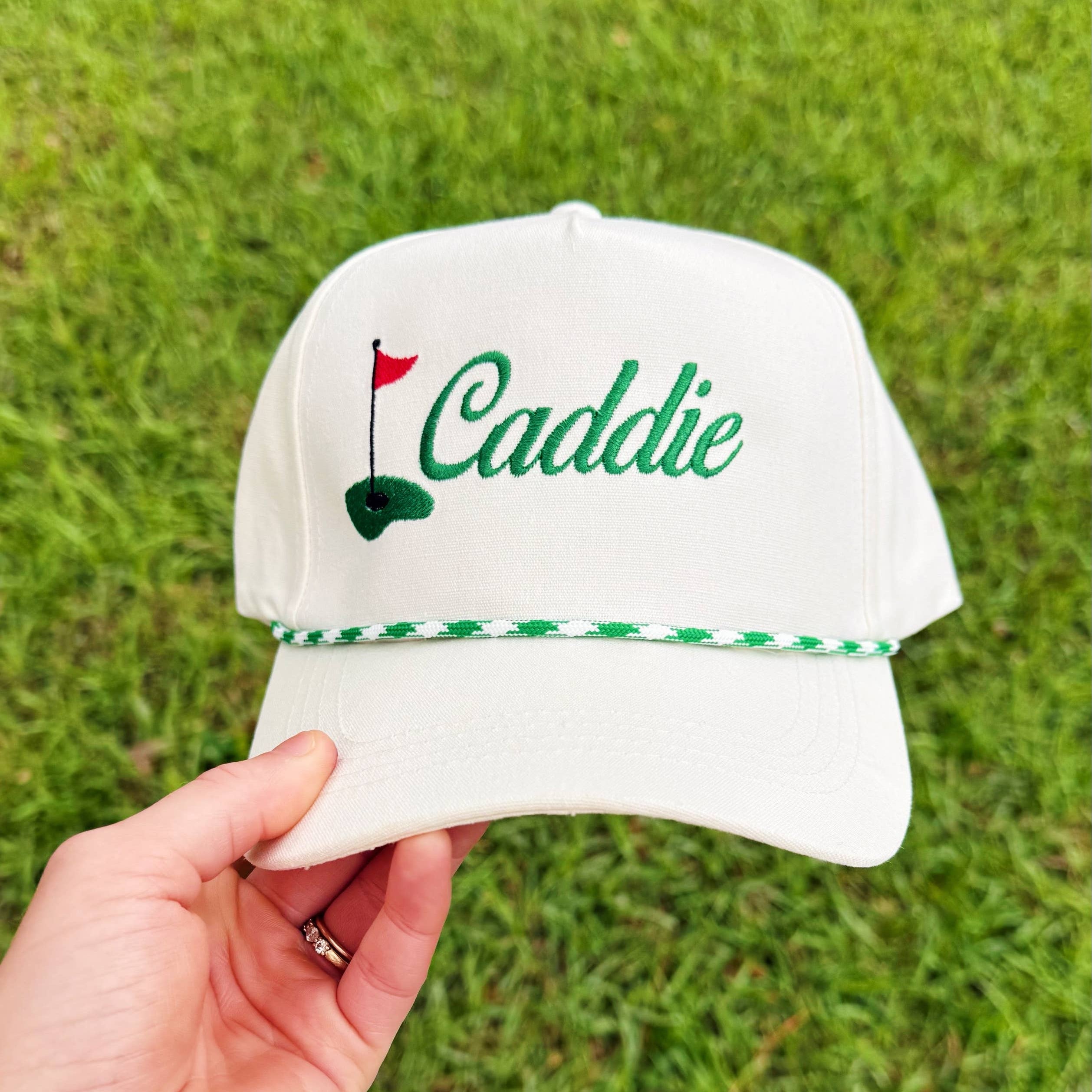 Caddie Baseball Hat held by a person outside at Addison West