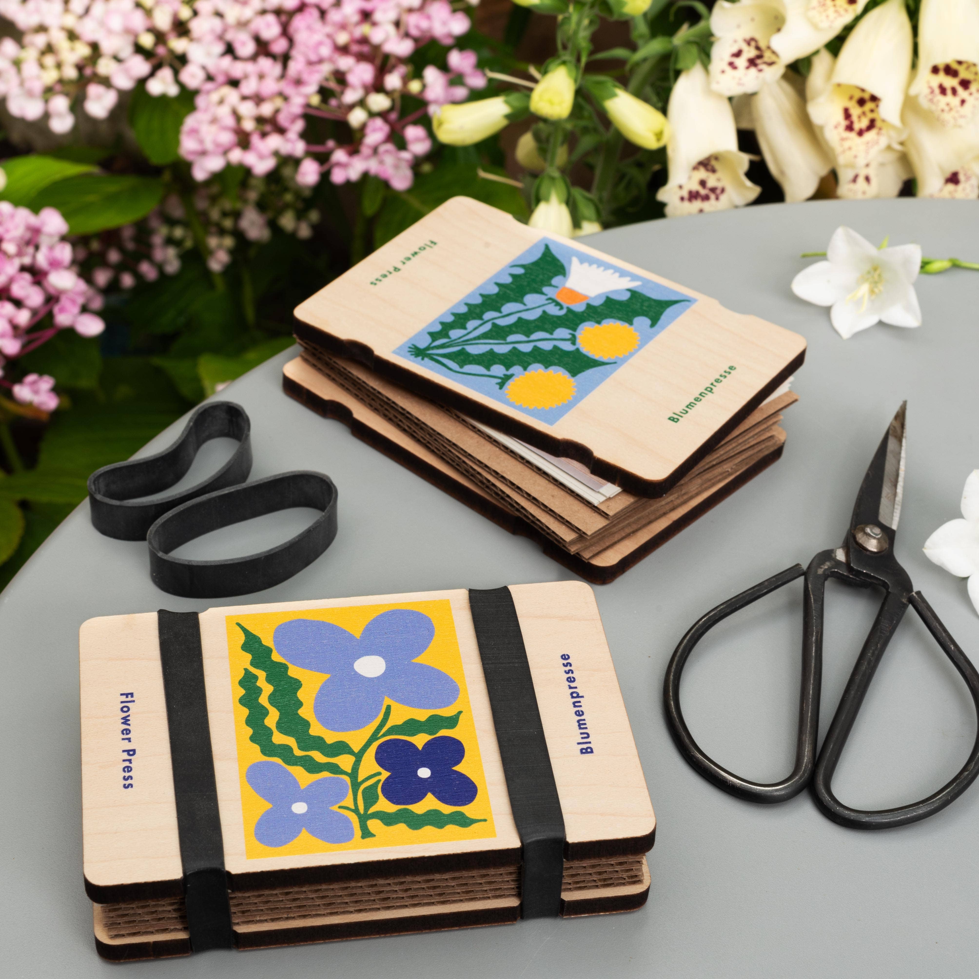 Pocket Flower Press in Smock on a table at Addison West
