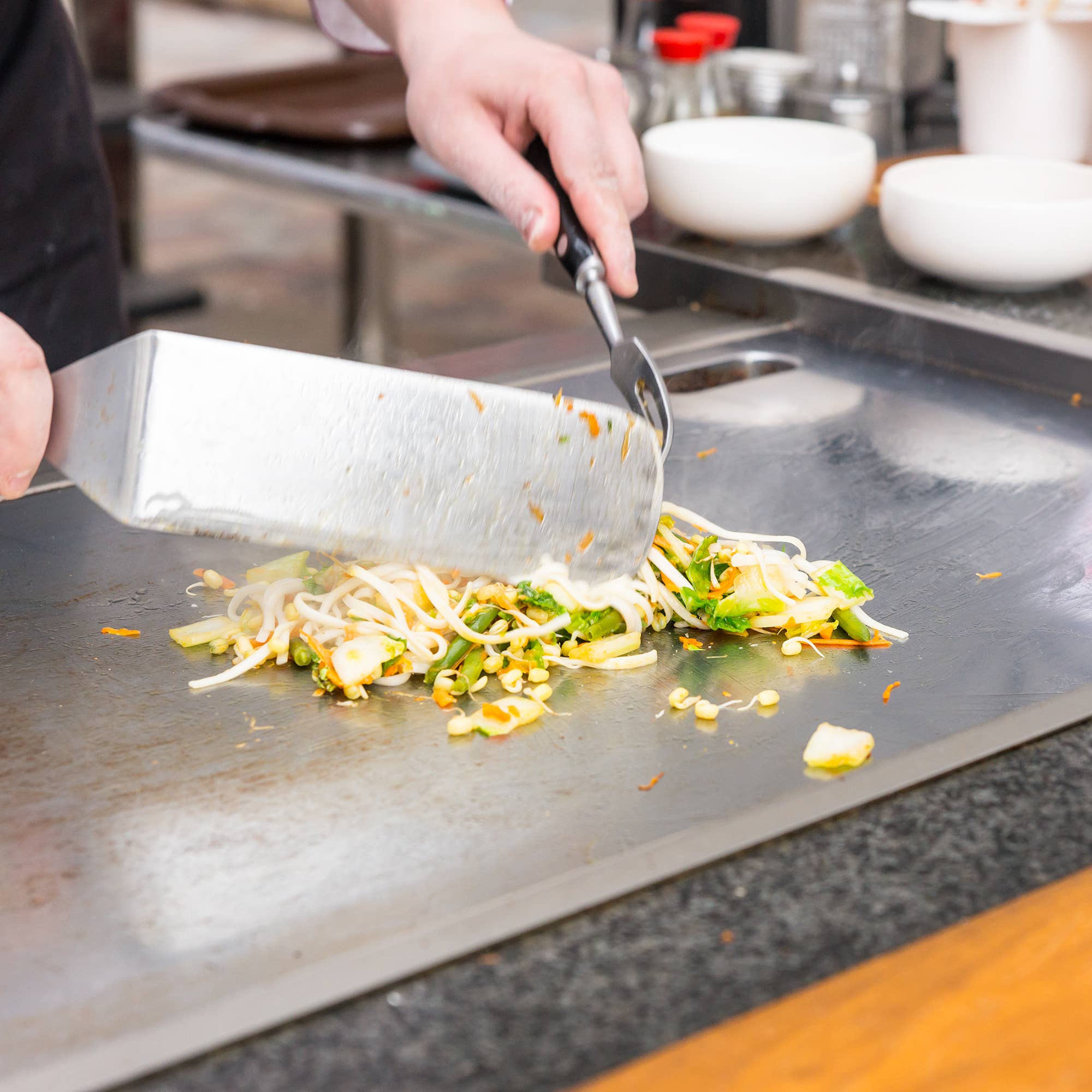 Griddle Spatula being used by a chef at Addison West