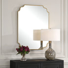 Lenora Accent Mirror on a beige wall above a table at Addison West