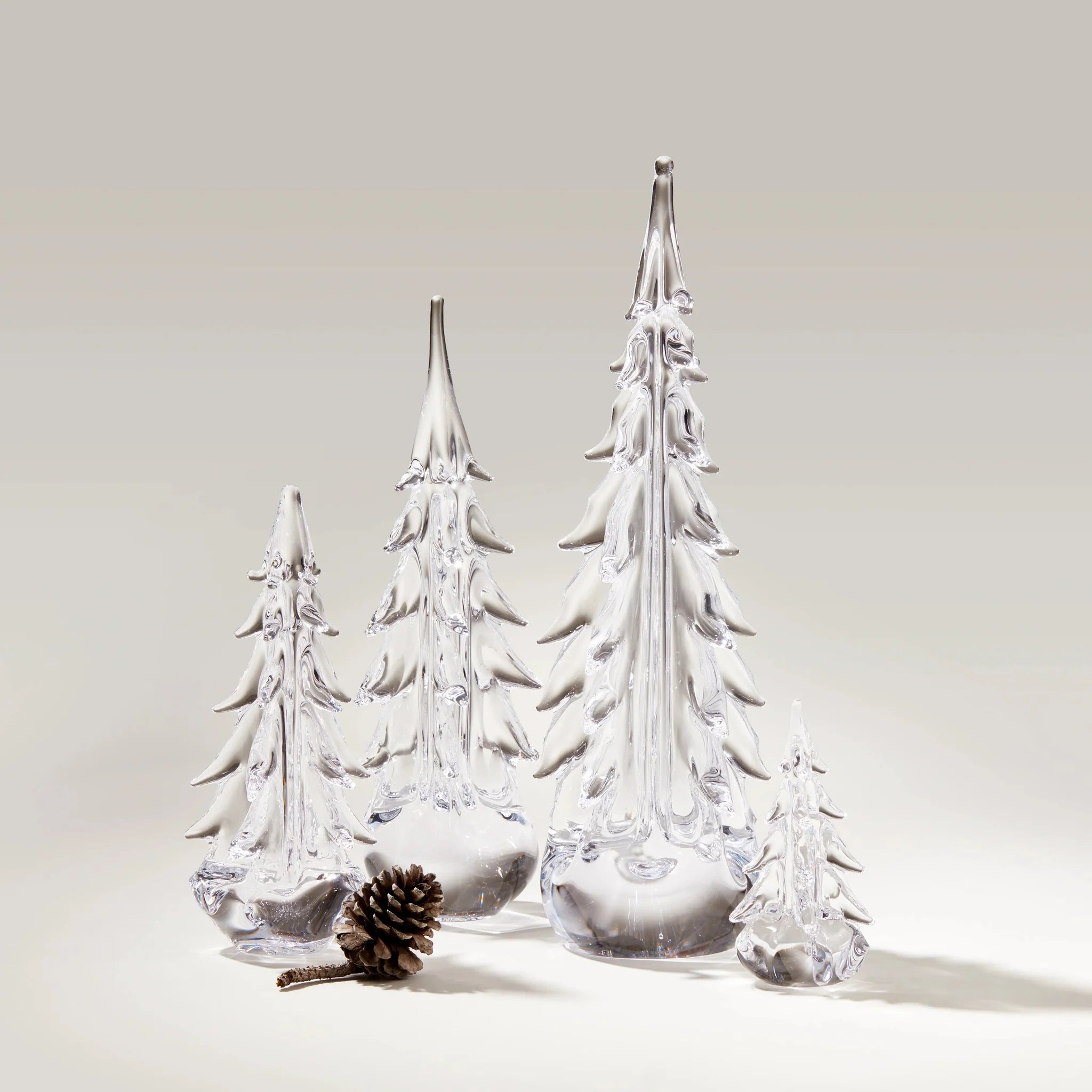 Simon Pearce Five Sided Evergreen trees on a white background at Addison West