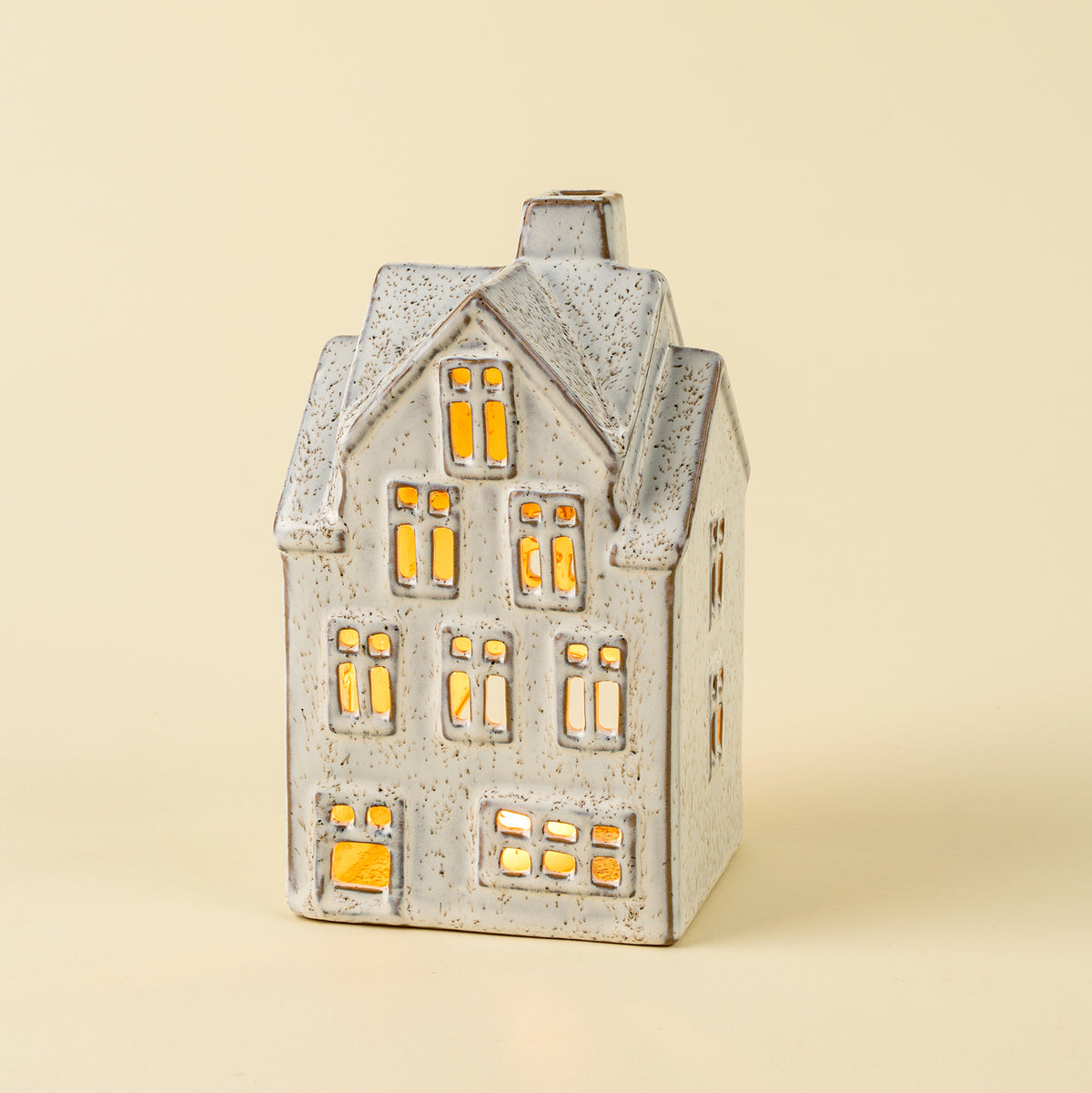 Large Winter Chalet Tealight House on a beige background at Addison West