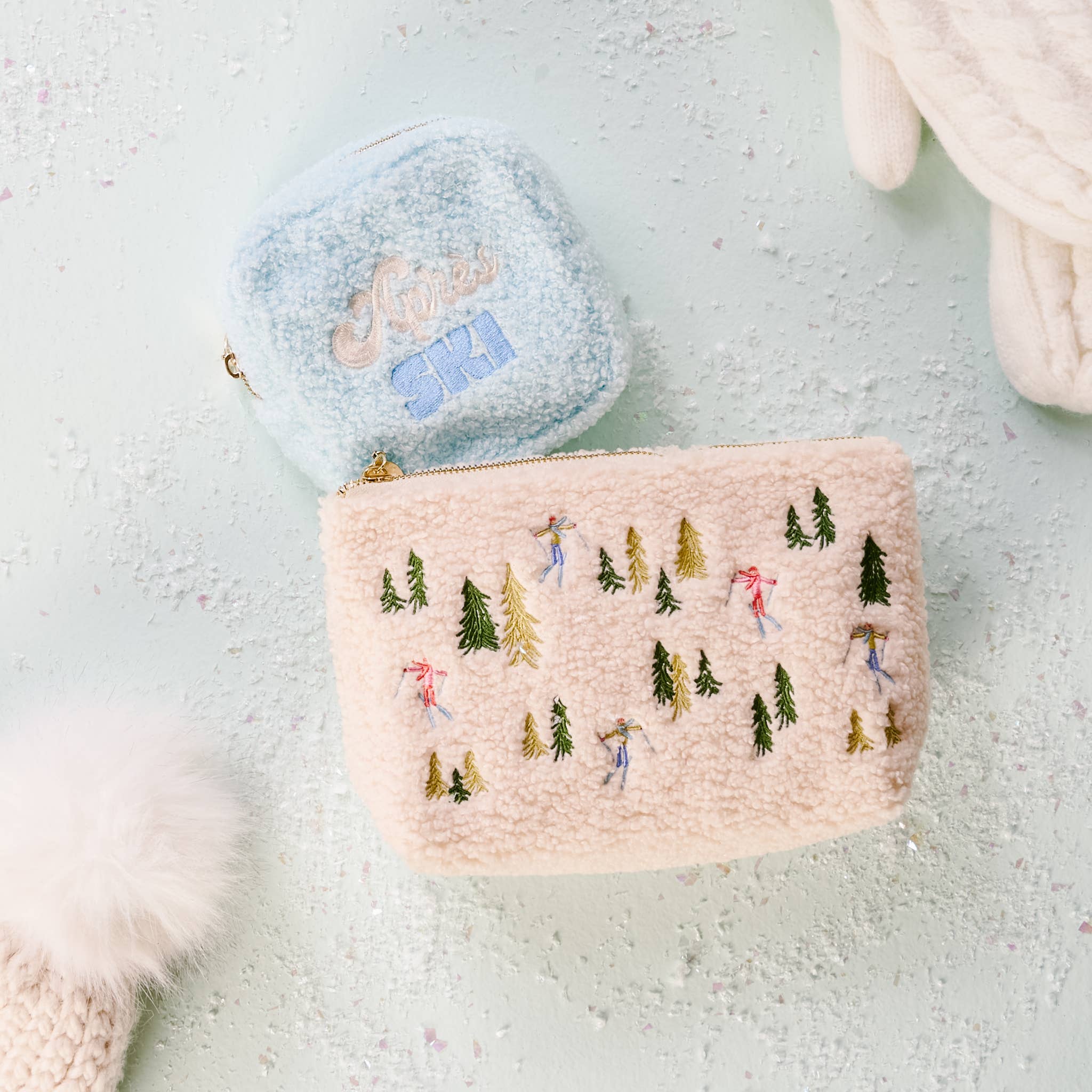 Teddy Pouch-Aprés Ski on a blue background at Addison West