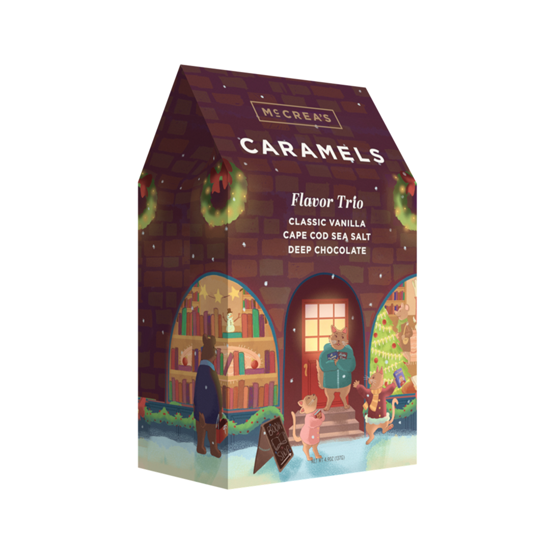 McCrea's flavor trio gabled brown box with festive holiday cat family illustration