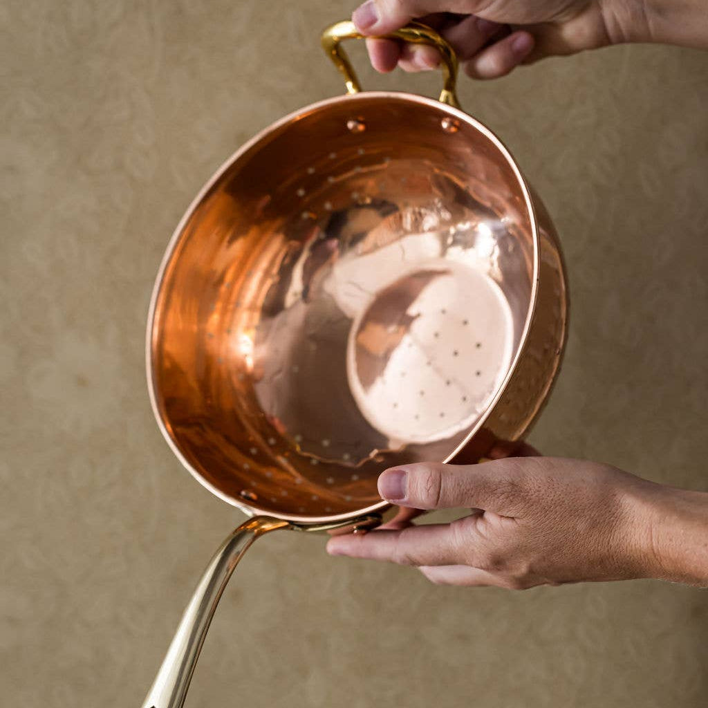 Galley and Fenn Copper Colander on a beige background at Addison West
