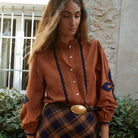 Leonor Blouse in Caramel on a white background at Addison West