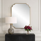 Lenora Accent Mirror on a beige wall above a table at Addison West