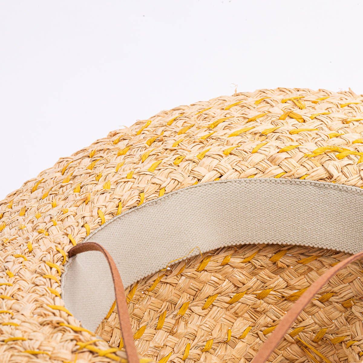 Skiff Sun Hat in Natural on white background at the Addison West.