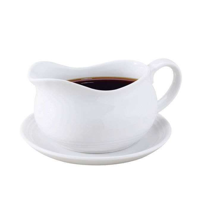 White Porcelain Gravy Boat With Saucer on a white background at Addison West