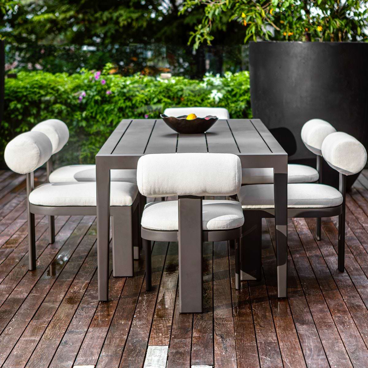 Porter Indoor–Outdoor Dining Table on a patio at Addison West