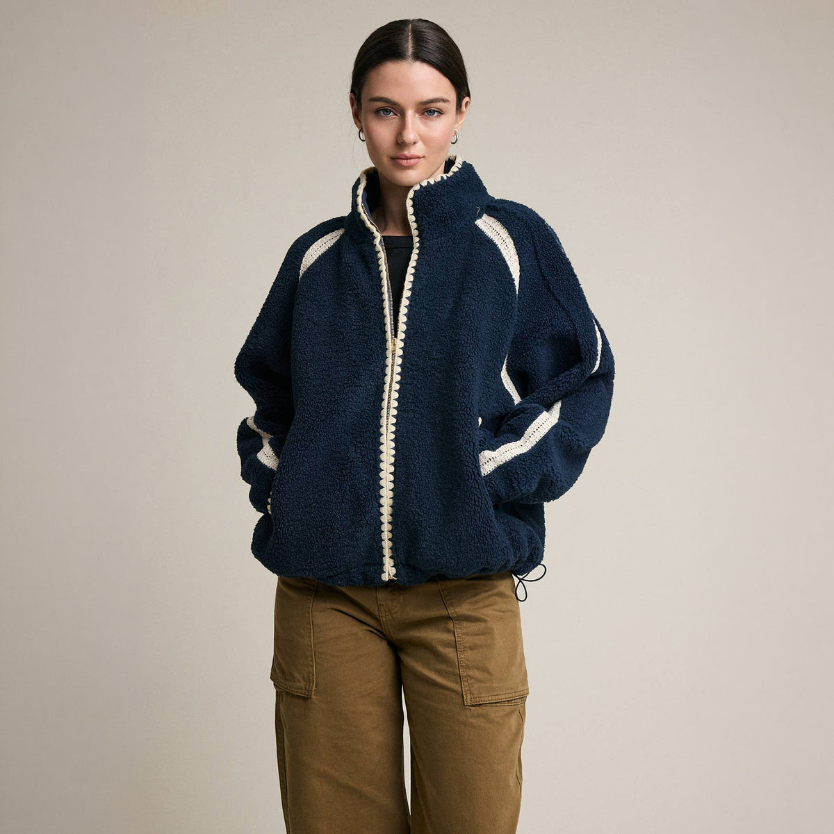 Contrast Trim Sherpa Zip-Up Jacket in Navy on a model at Addison West