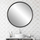 Dawsyn Round Mirror on a white bathroom wall at Addison West