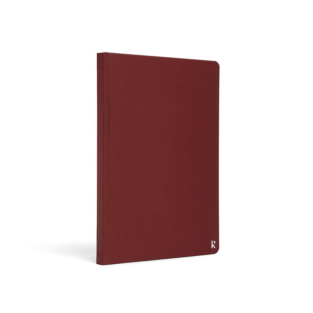 Karst A5 Hardcover Lined Notebook in Pinot on a white background at Addison West