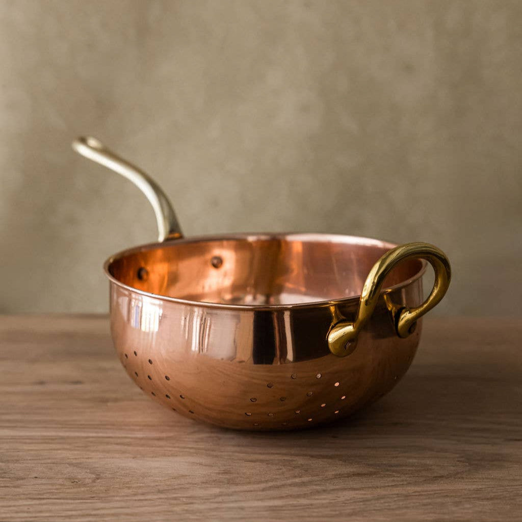 Galley and Fenn Copper Colander on a wood table at Addison West