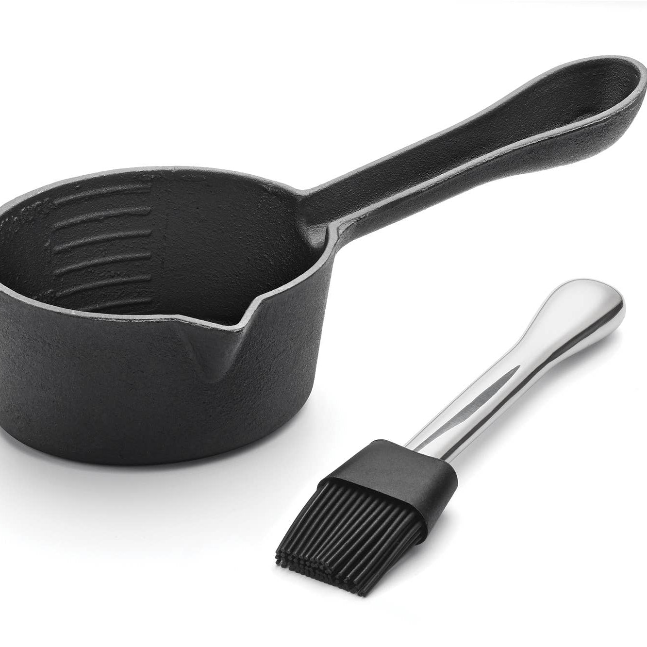 Black ladle and brush on a white background