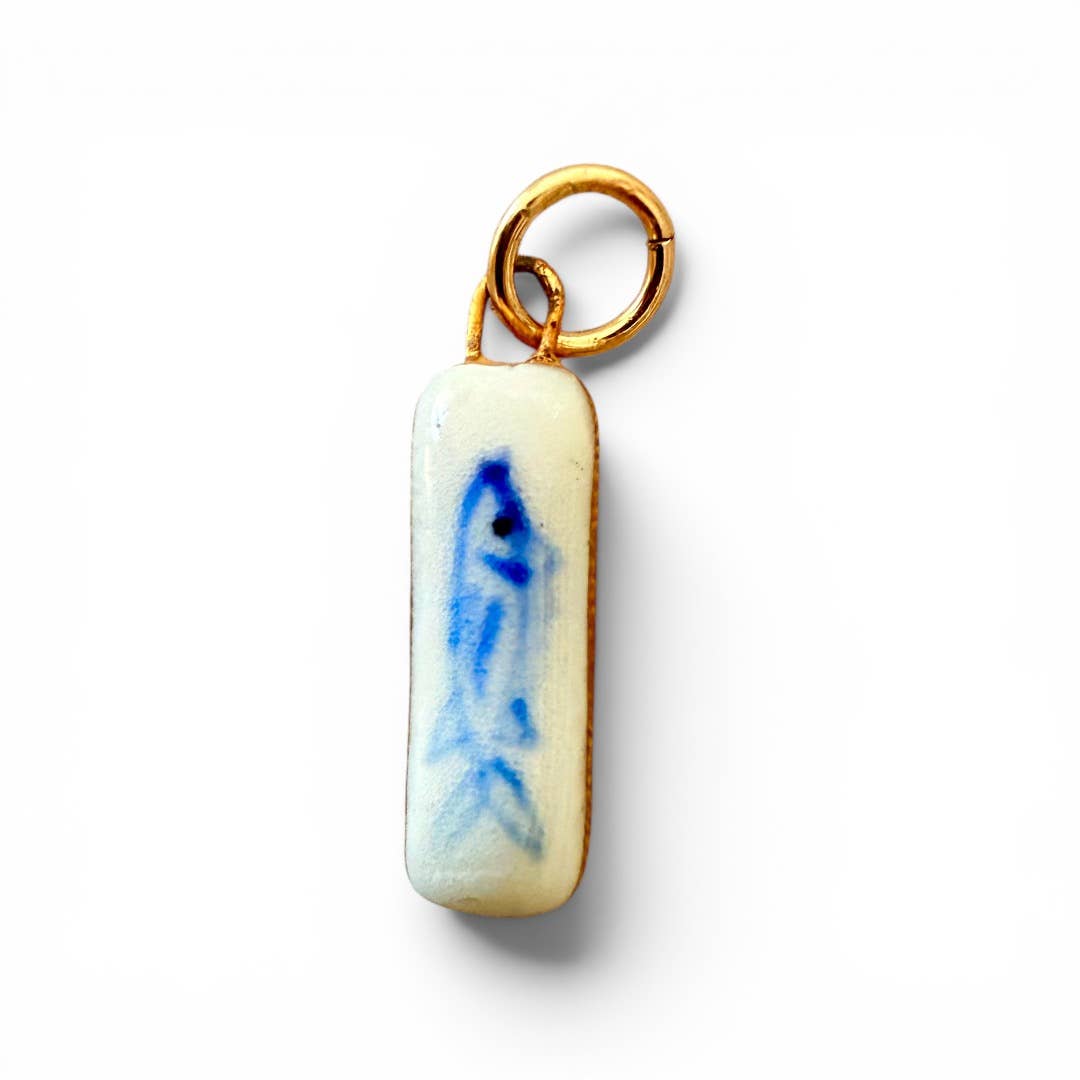 Lucky Fish Charm on a white background at Addison West