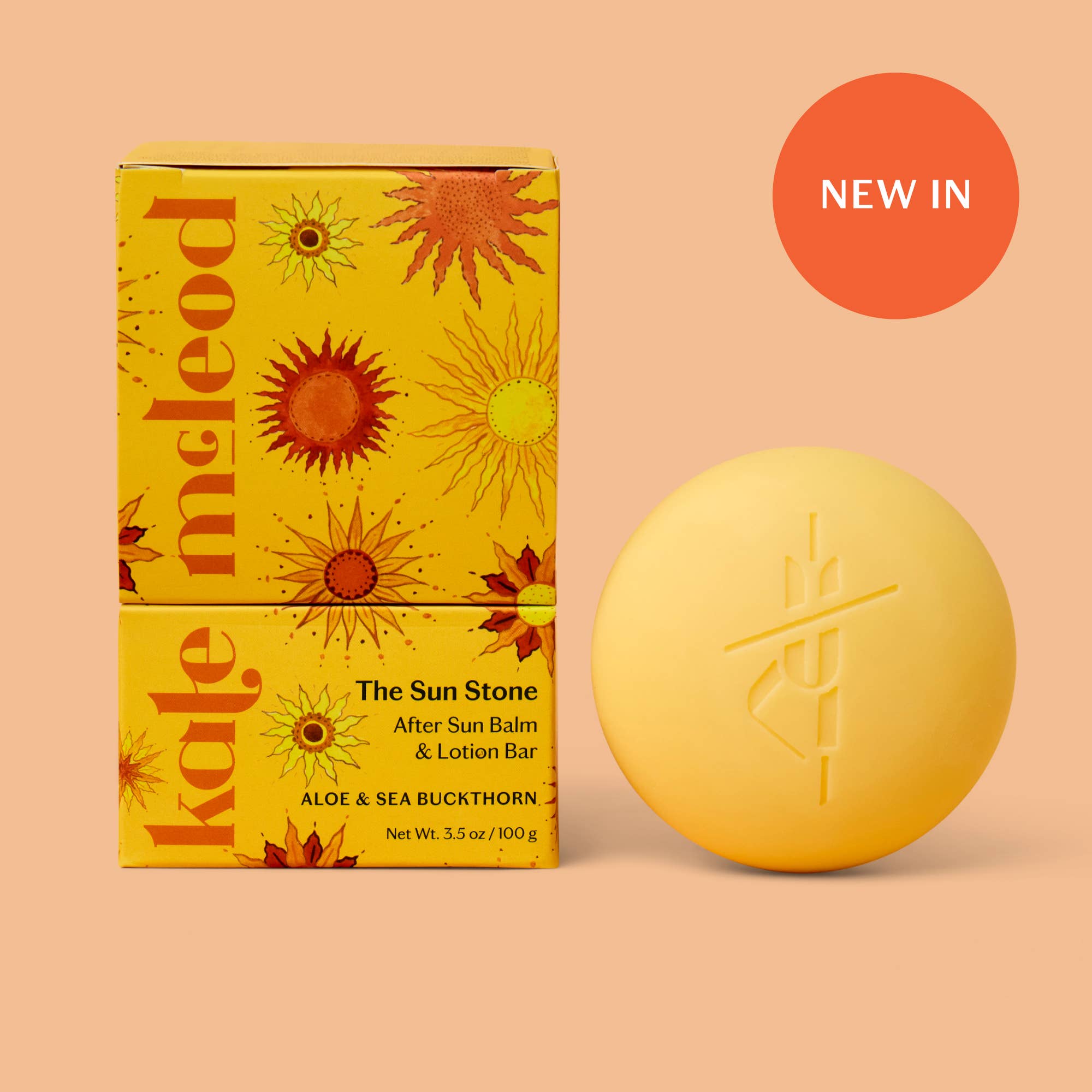 Kate McCloud yellow lotion bar and packaging with floral design on a peach background