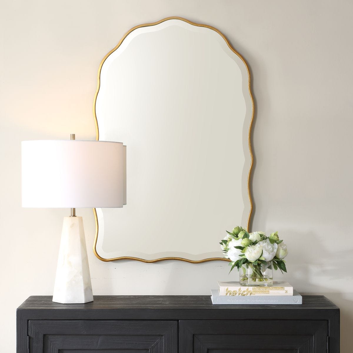 Maribelle Arch Accent Mirror on a white wall above a table at Addison West