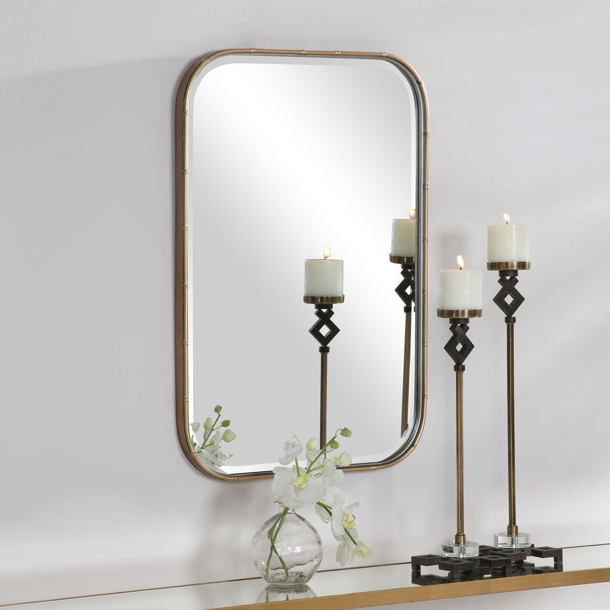 Marwell Vanity Accent Mirror on a white above a table at Addison West