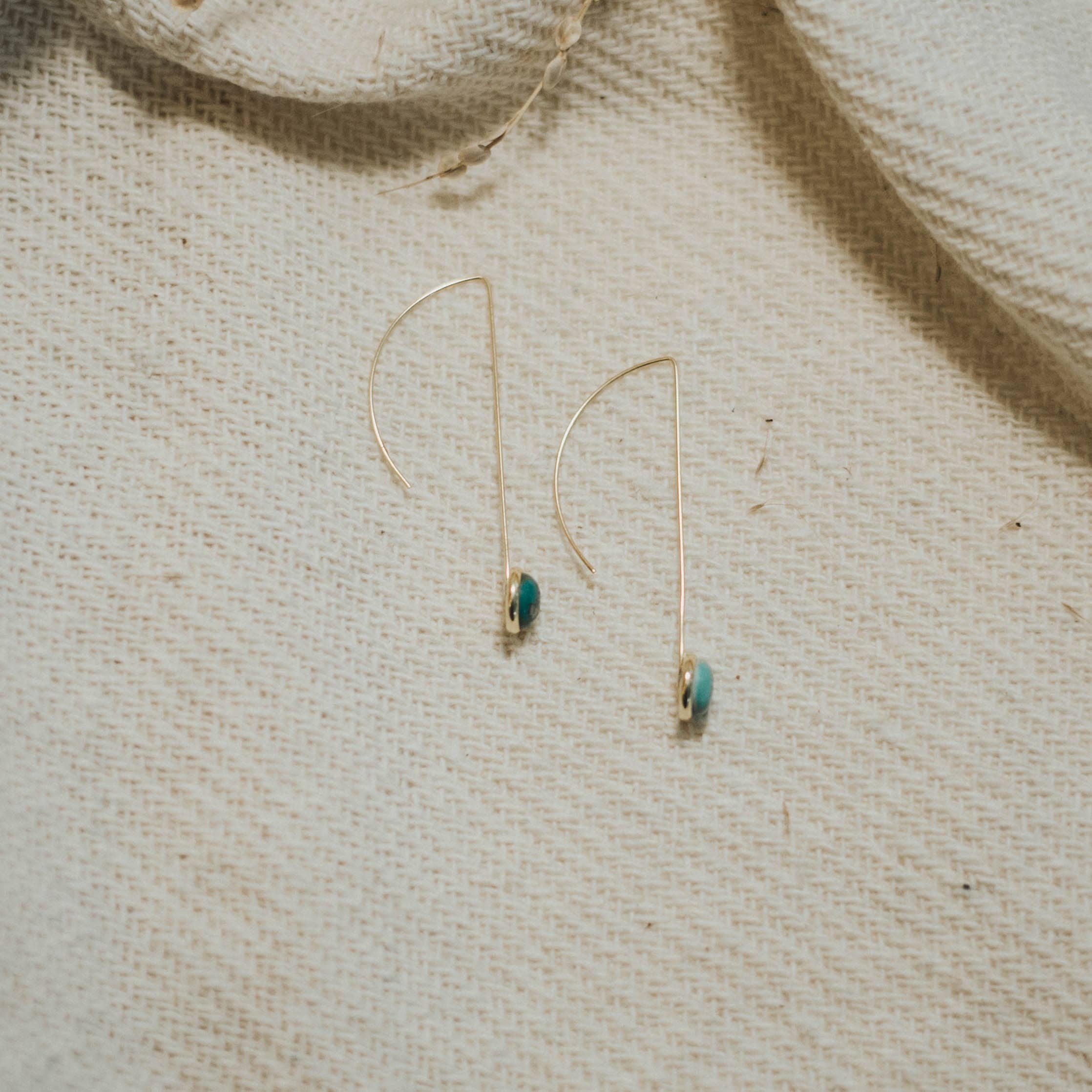 Commonform Anther Drops in Turquoise on white background at the Addison West.