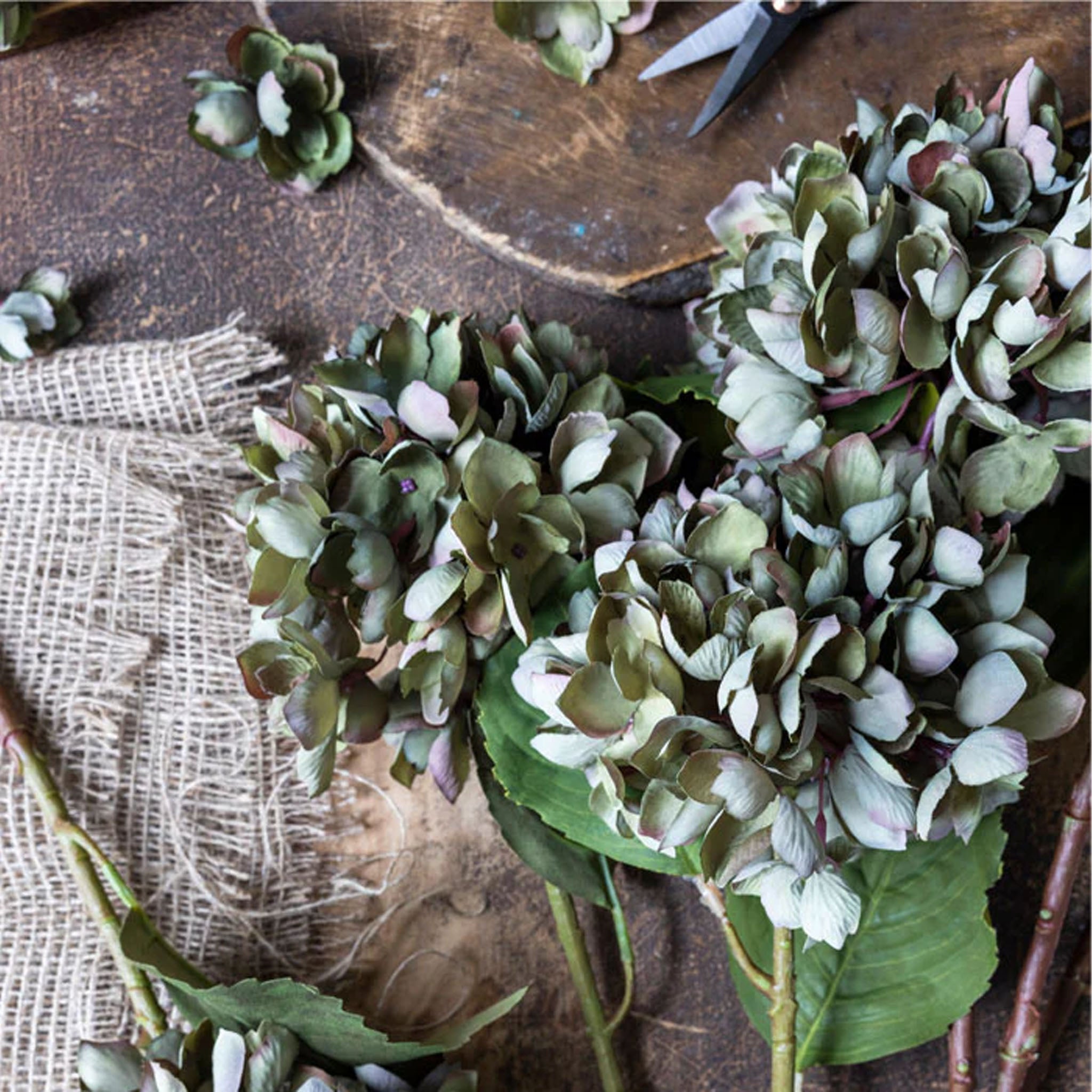 Abigail Ahern Faux Hydrangea, Chloris on a wood table at Addison West