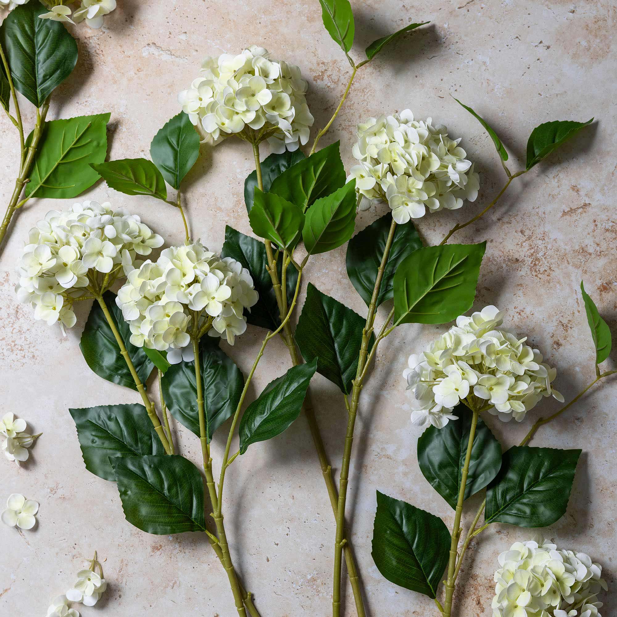 Abigail Ahern Real Touch Artificial Hydrangea in Zest on a beige background at Addison West